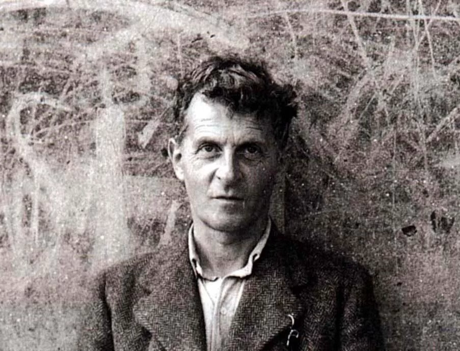 Ludwig Wittgenstein in front of graffiti in Swansea